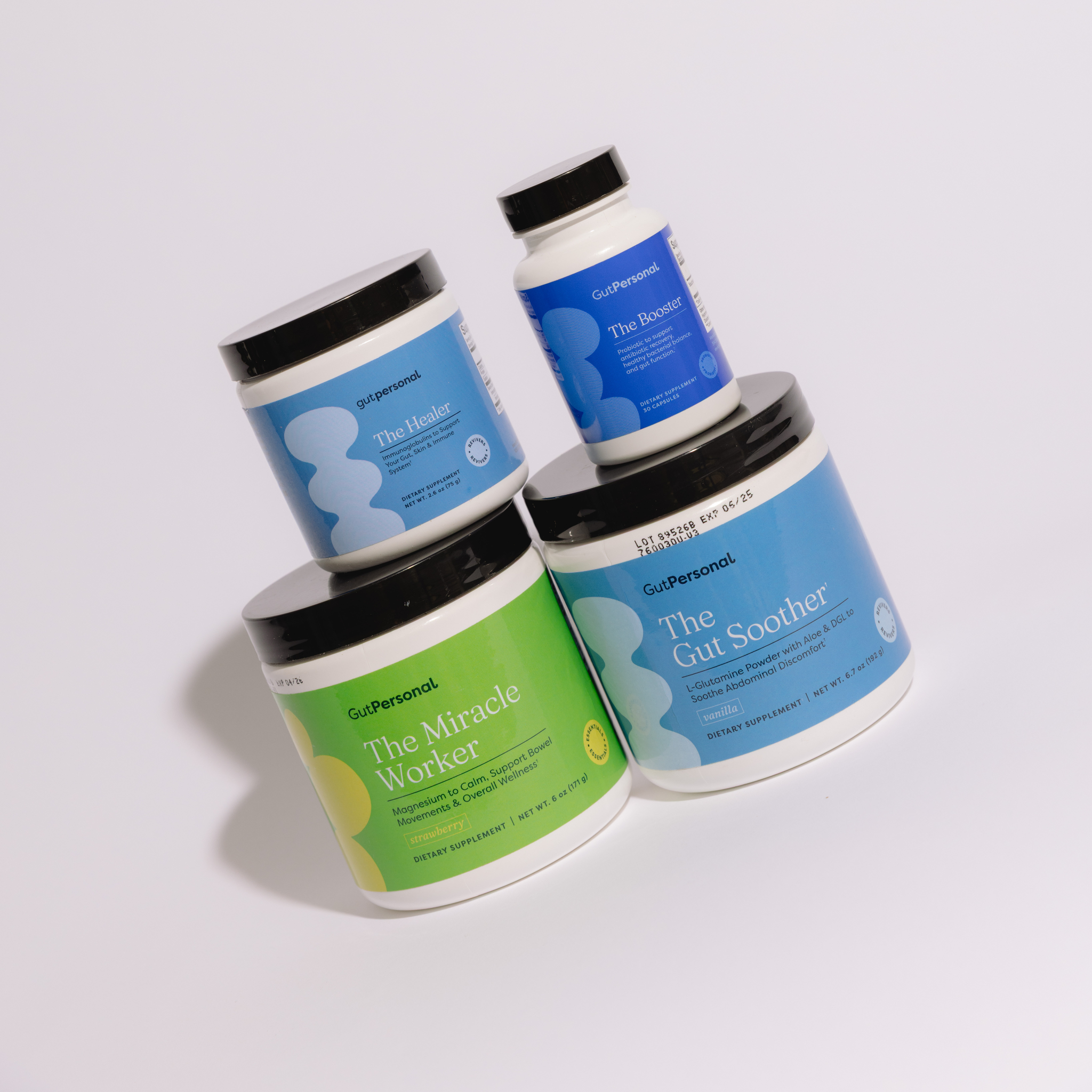 Four containers of Gut Personal supplements on a light gray background