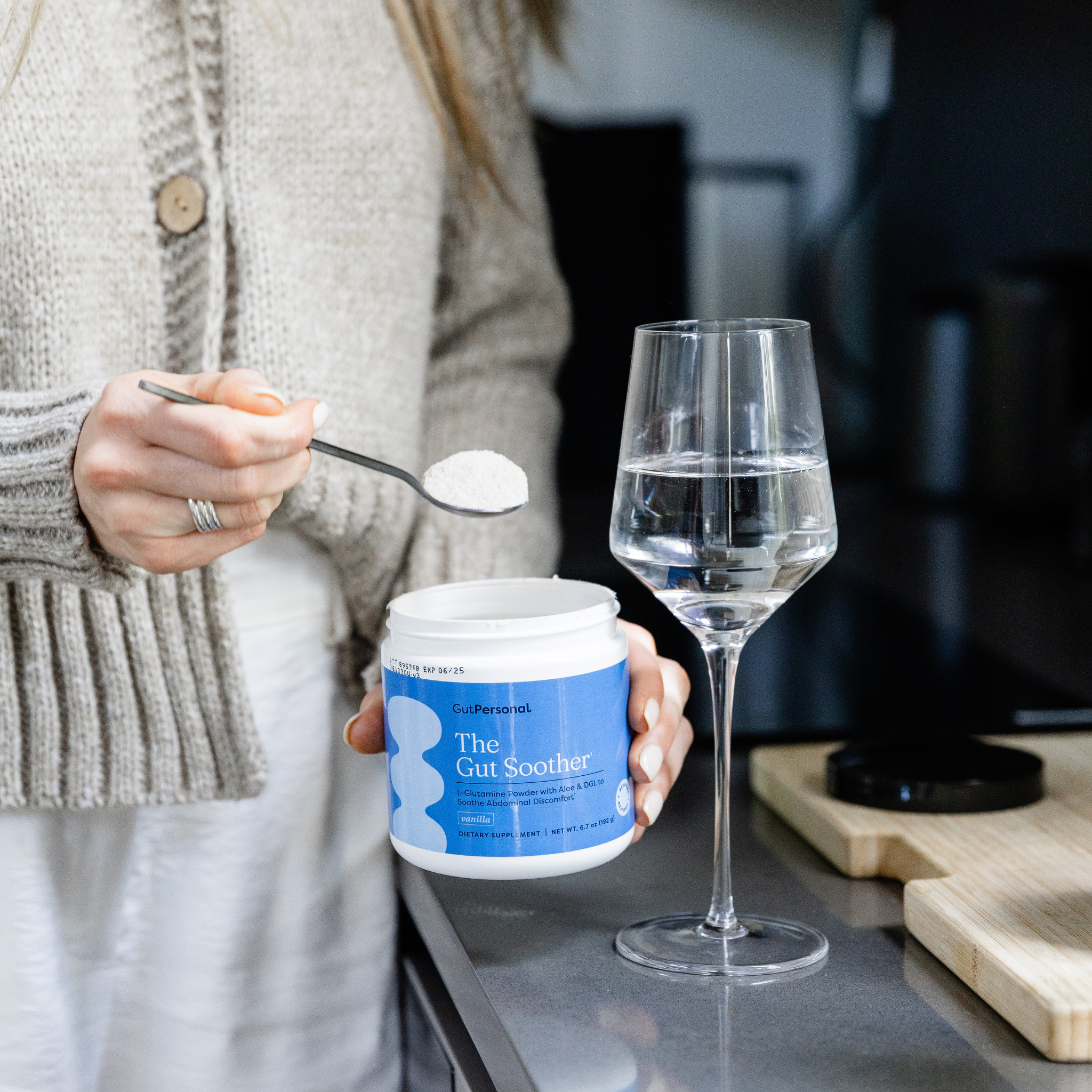 glass of water and gut soother supplement