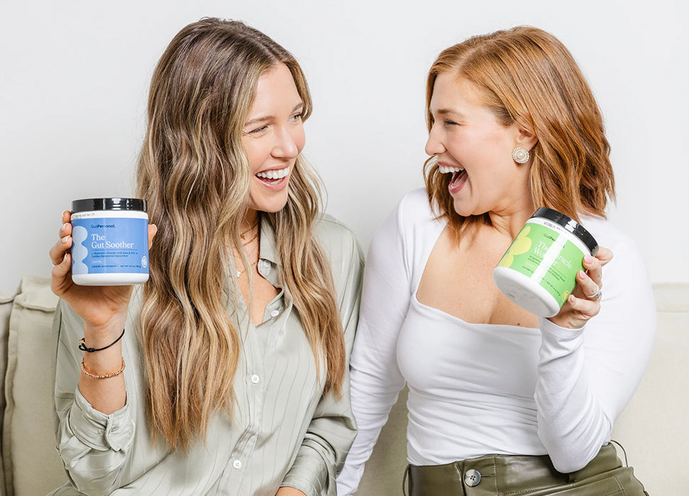 Two women holding containers of a product, likely a supplement or skincare item, against a plain background.