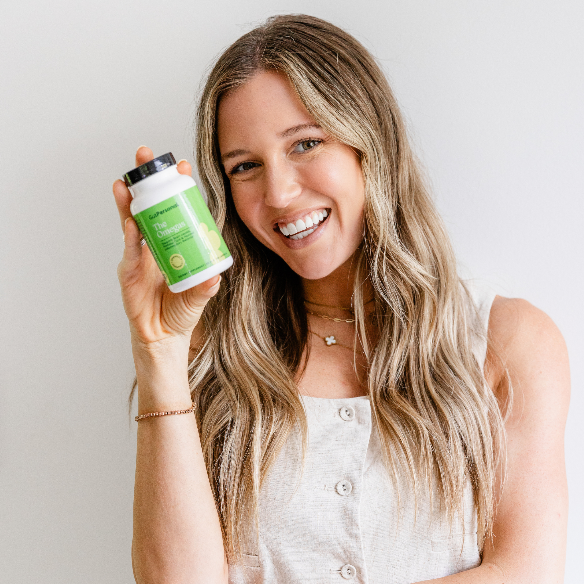 women holding gutpersonal omegas