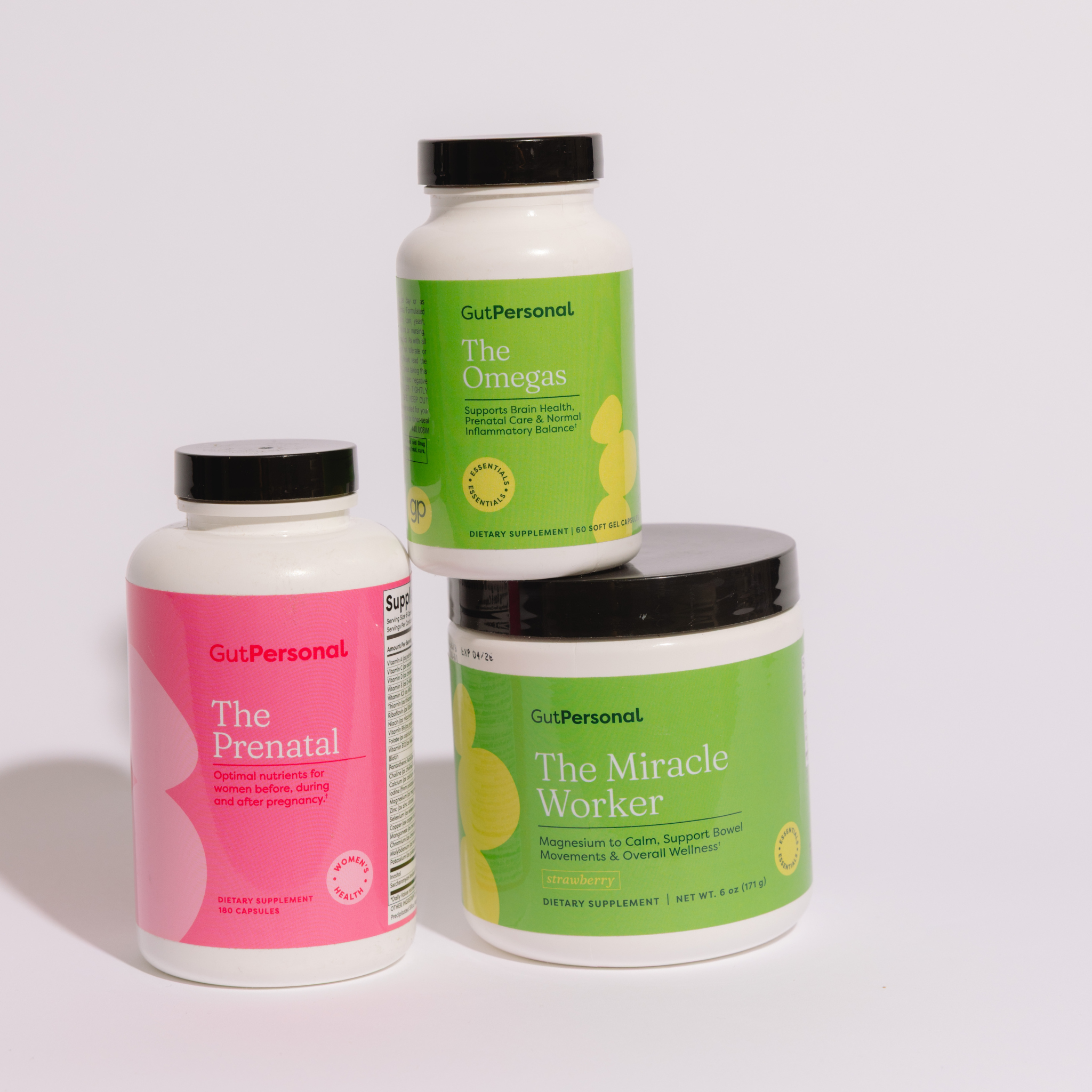 Three GutPersonal supplement bottles on a white background