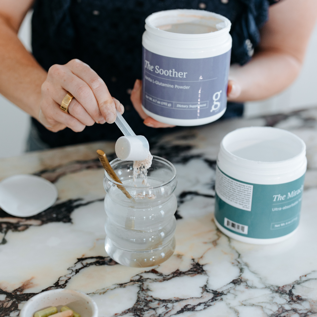 A photo of someone mixing The Soother supplement into water