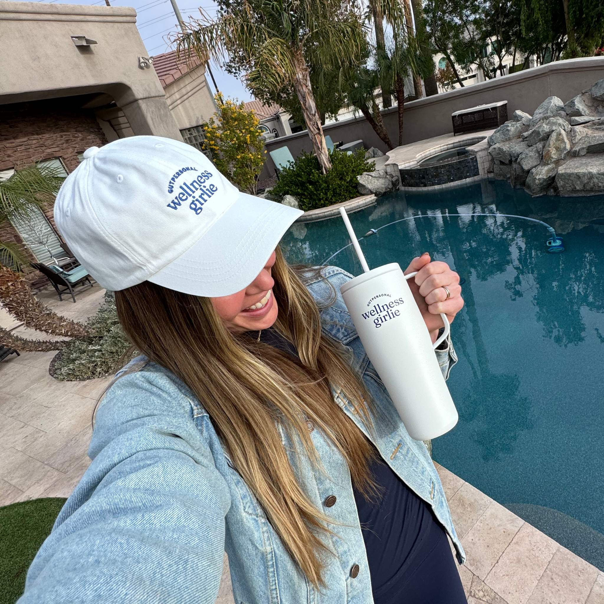 image of the wellness girlie hat and the wellness girlie water bottle by gutpersonal